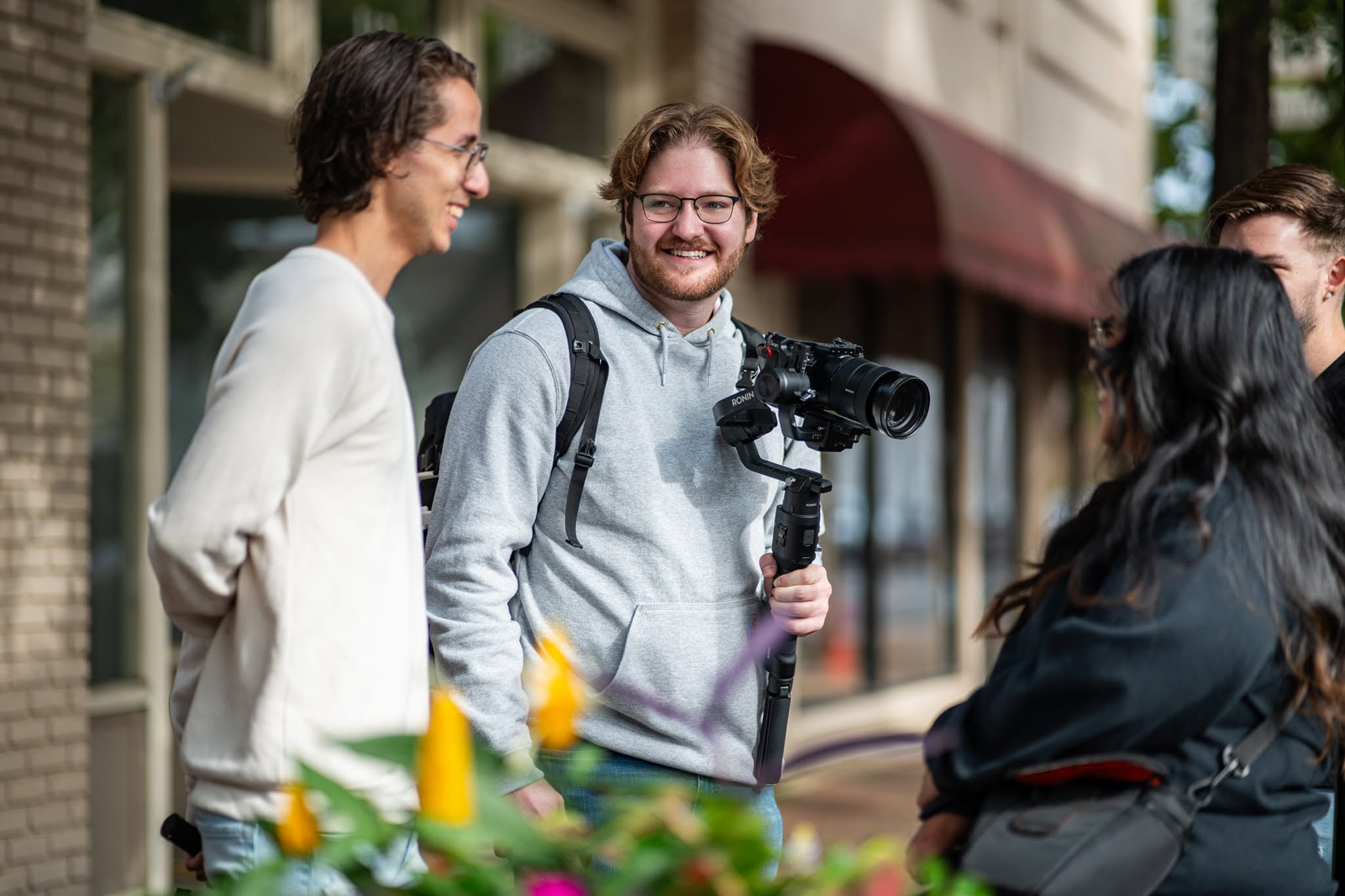 Church creatives connecting around a professional camera and gimbal