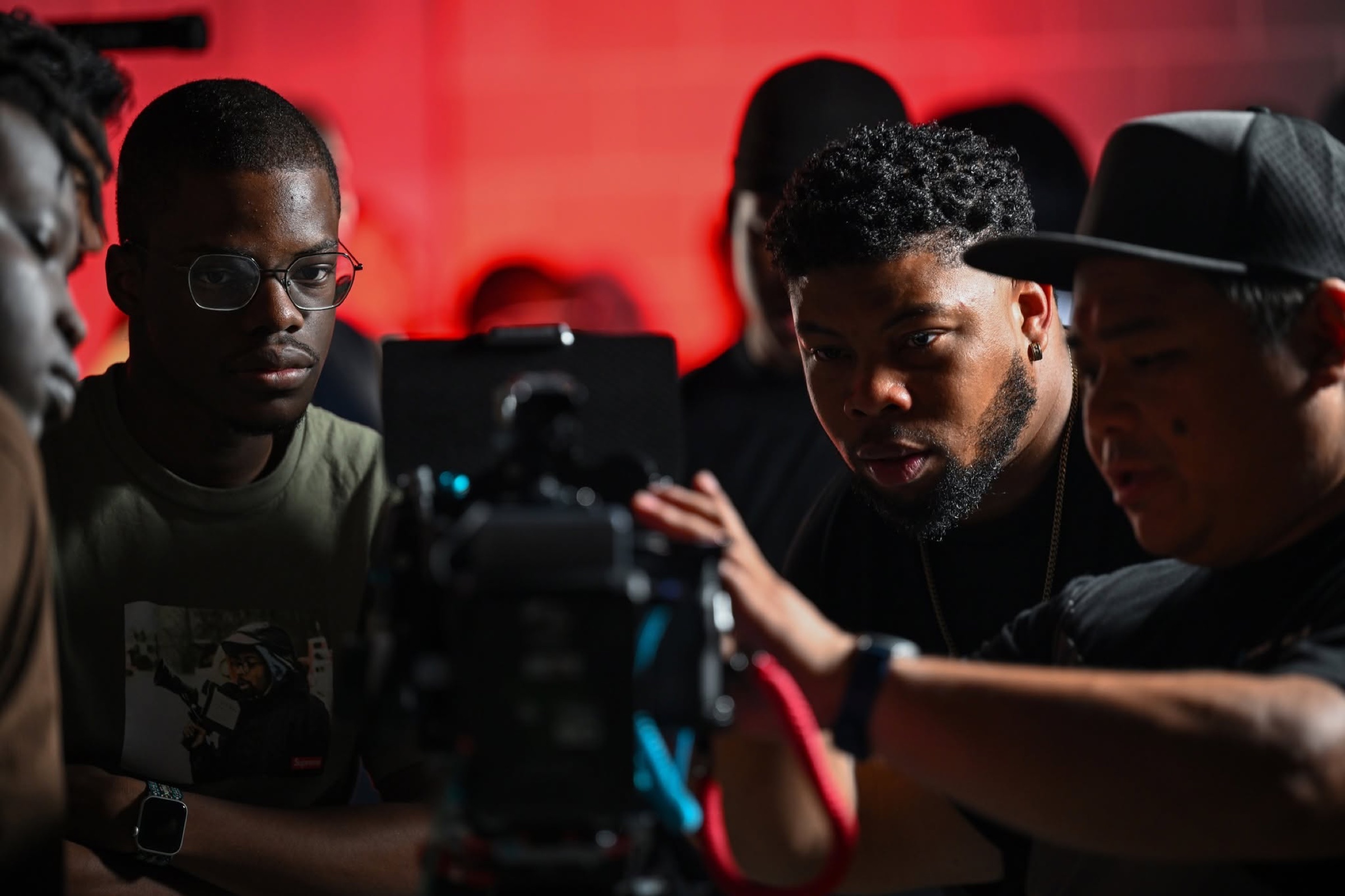 Church creatives collaborating around a professional cinema camera