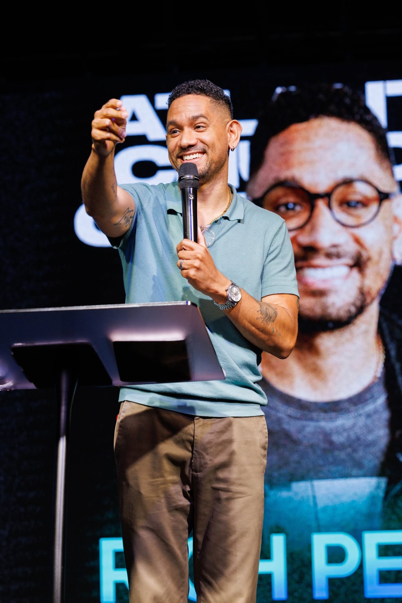 A conference speaker sharing insight from the main stage