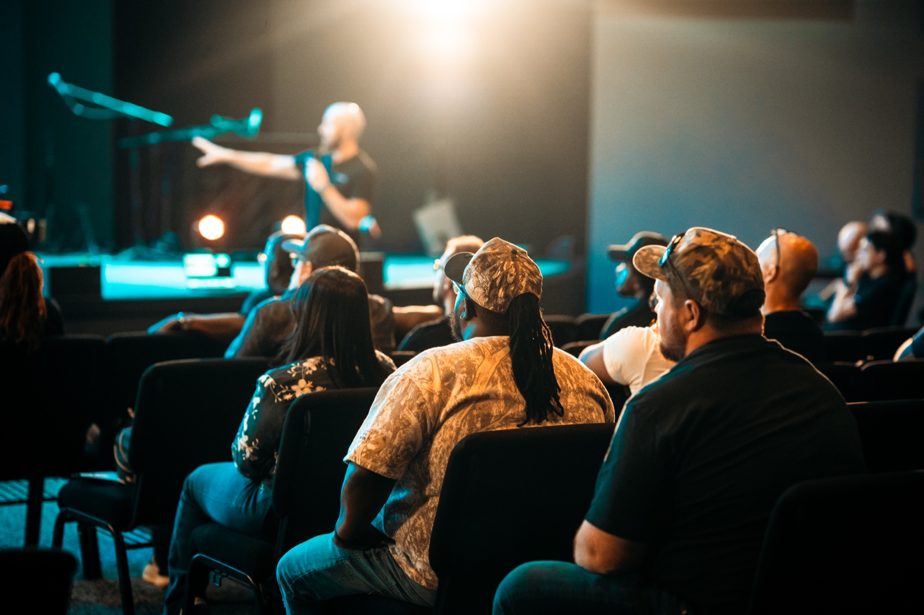 Conference attendees learning together during a main-stage session