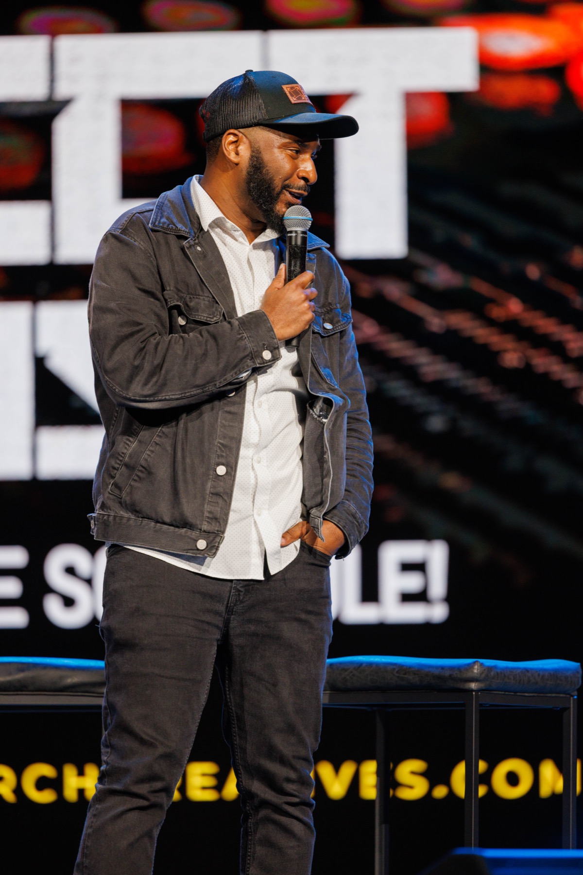 A conference speaker answering a question during a main-stage session