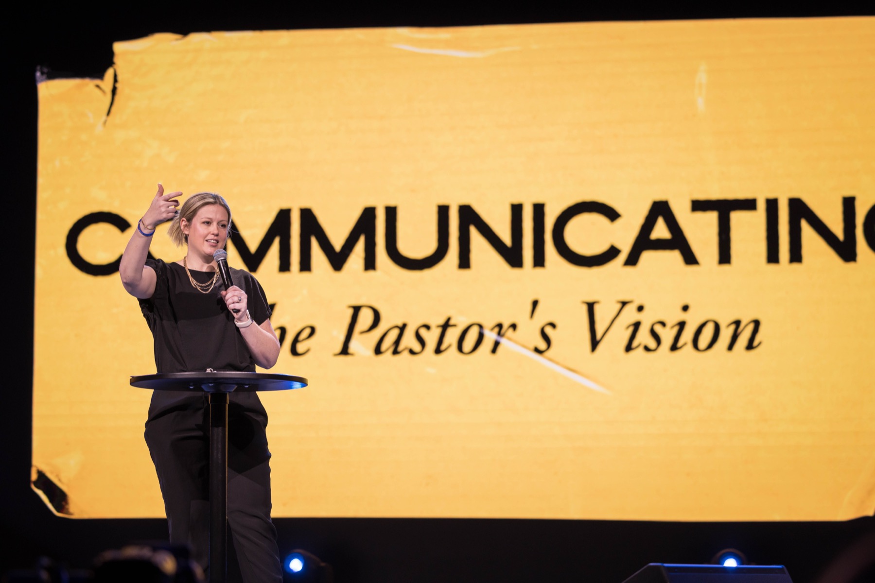 A conference speaker teaching a communications session